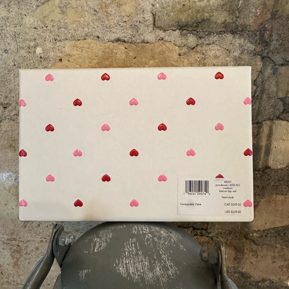 Kate Spade wallet is a light pink wallet adorned with small heart-shaped studs - Picture 4 of 16